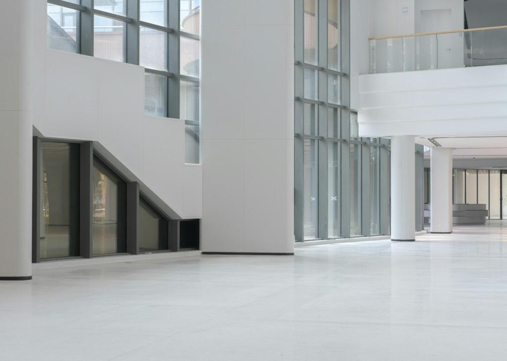 Modern white interior with large windows and columns