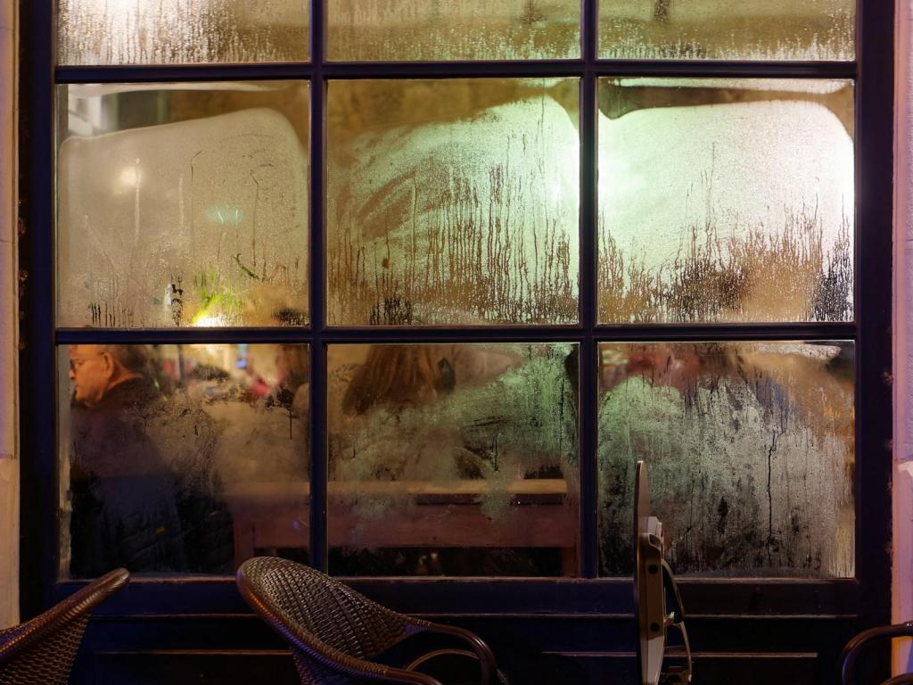 a couple of chairs sitting in front of a window